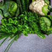 Vegetables Green on the gray background.Food or Healthy diet concept.Super Food.Vegetarian.Top View.Copy space for Text.selective focus.
